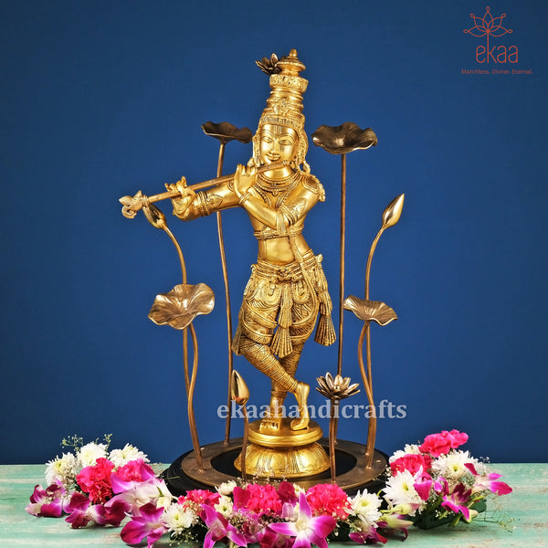 Brass Lord Krishna on Wooden Pedestal with Lotus Flowers