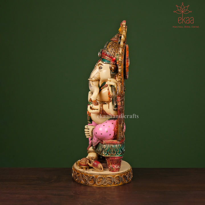 Decorative statue of a deity with intricate details on a dark surface and green background, featuring the brand 'ekaa'.