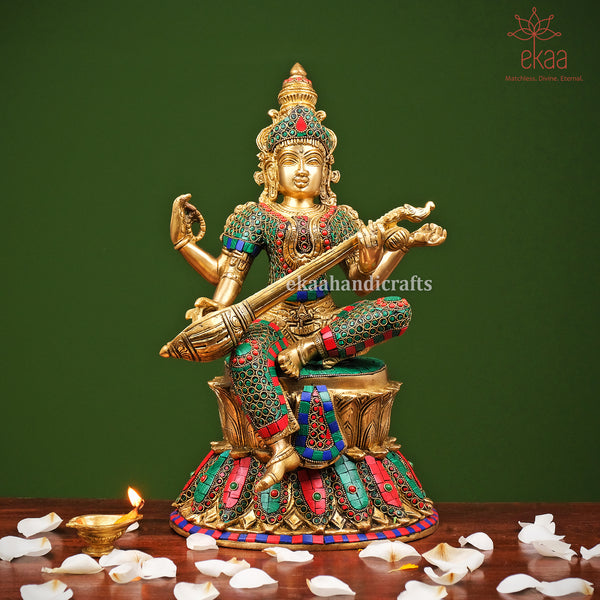 Brass Goddess Saraswati Sitting on Lotus with Stonework